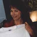  Jen holds up a T-Shirt of her