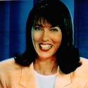 Jen laughs reading the news,Nov 1995